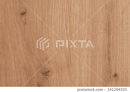 Horizontal close-up view of a natural light brown wooden texture showing detailed organic grain patterns and small dark knots on a polished timber surface Horizontal close-up view of a natural light brown wooden texture showing detailed organic grain patterns and small dark knots on a polished timber surface 141294503