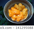 Close-up of two types of fresh sea urchin from Hokkaido served in a small bowl. 141295088