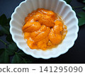 A close-up of fresh sea urchin from Hokkaido served in a small bowl. 141295090