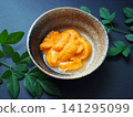 Fresh sea urchin from Hokkaido served in a small bowl 141295099