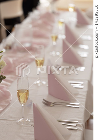 Wedding reception table setup with champagne flutes Wedding reception table setup with champagne flutes 141295510