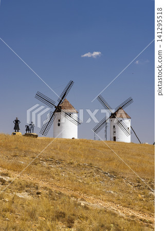 Don Quixote sculptures overlooking traditional windmills Mota del Cuervo Don Quixote sculptures overlooking traditional windmills Mota del Cuervo 141295518