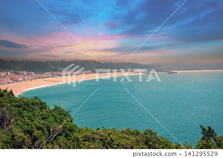 Atlantic ocean, beach in Nazare. View from mount of Nazare city in evening, Portugal, Europe 141295529