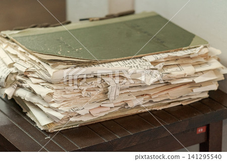 Old documents, ledgers, ancient manuscripts, documents, bundles of documents, archives, historical materials, retro Old documents, ledgers, ancient manuscripts, documents, bundles of documents, archives, historical materials, retro 141295540