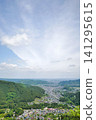 Overlooking the mountain from the mountains 141295615