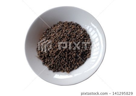 Pile of Black Peppercorns on a Plate Pile of Black Peppercorns on a Plate 141295829
