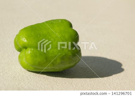 It is a close-up of a green bell pepper. It is a close-up of a green bell pepper. 141296701