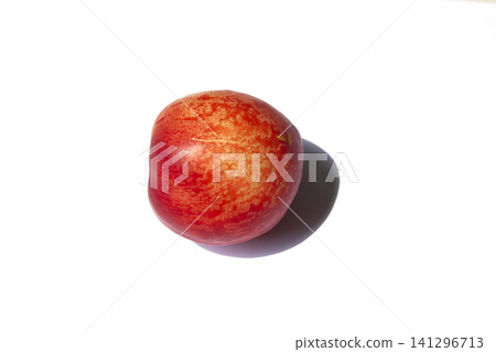 It is a Nectarine on a white background. It is a Nectarine on a white background. 141296713