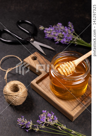 Honey in jar with lavender and rustic elements 141297325