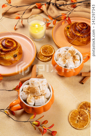 Autumn breakfast with cinnamon rolls and hot chocolate Autumn breakfast with cinnamon rolls and hot chocolate 141297343