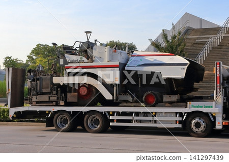 Image of an asphalt finisher transport vehicle. Image of an asphalt finisher transport vehicle. 141297439