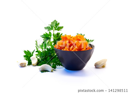 Korean carrot salad with parsley on white background Korean carrot salad with parsley on white background 141298511