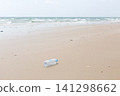 Empty Used Plastic Bottle on Remote Deserted Sea Sand Tropical Beach 141298662