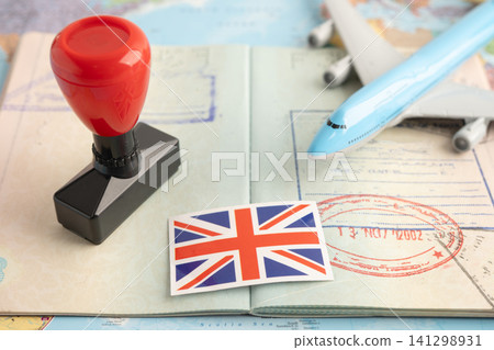 UK United Kingdom flag with passport and airplane for travel. 141298931