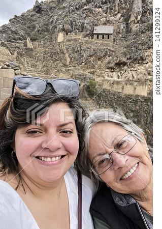 Family posing at ancient Inca Temple ruins Family posing at ancient Inca Temple ruins 141299124