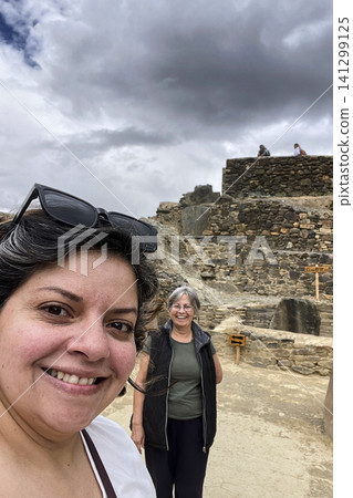Women taking selfie overlooking Ollantaytambo town. UGC Women taking selfie overlooking Ollantaytambo town. UGC 141299125