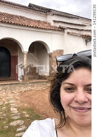Woman in front of Chinchero colonial church. UGC Woman in front of Chinchero colonial church. UGC 141299130
