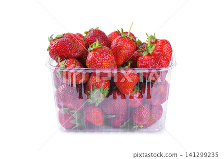 Fresh red strawberry in plastic punnet or transparent box, container isolated on white background Fresh red strawberry in plastic punnet or transparent box, container isolated on white background 141299235