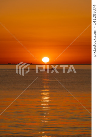 Sunrise over Beppu Bay and ships as seen from Beppu, Oita Prefecture, Japan. 141299374