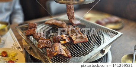 Delicious Marinated Korean Beef Short Ribs Grilling on Charcoal Barbecue Delicious Marinated Korean Beef Short Ribs Grilling on Charcoal Barbecue 141299521