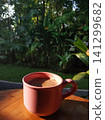 A mug of tea on a beautiful tropical background of rice fields 141299682
