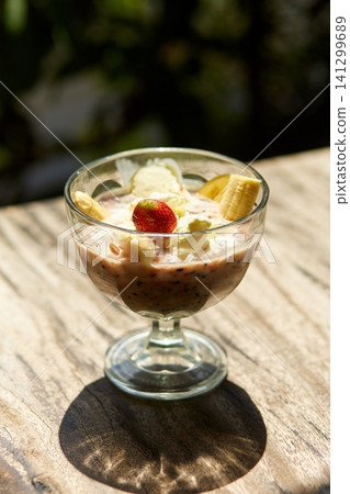 The traditional Indonesian dessert of black rice pudding Bubur Injin. The traditional Indonesian dessert of black rice pudding Bubur Injin. 141299689