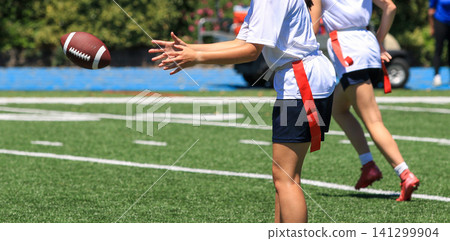 Quarterback Receiving the Football During a Flag Football Game Quarterback Receiving the Football During a Flag Football Game 141299904