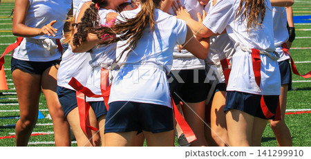 Team Celebrates During a Flag Football Game in Sunny Weather Team Celebrates During a Flag Football Game in Sunny Weather 141299910
