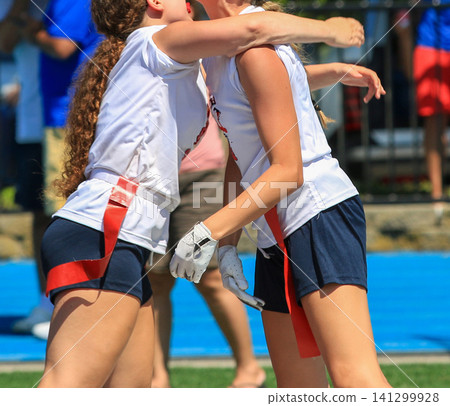 Friends Celebrate a Victory During a Sports Event in Sunny Weather Friends Celebrate a Victory During a Sports Event in Sunny Weather 141299928
