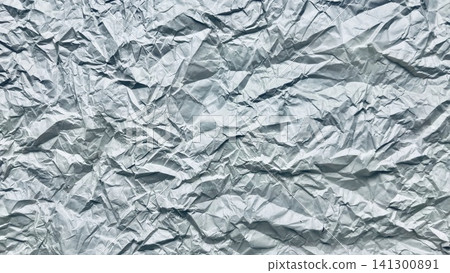 intensely crumpled metallic silver foil abstract texture with sharp folds deep wrinkles and glossy reflections intensely crumpled metallic silver foil abstract texture with sharp folds deep wrinkles and glossy reflections 141300891