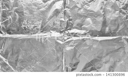 crumpled aluminum foil abstract texture with intricate metallic creases and dramatic shiny reflections in minimalist closeup crumpled aluminum foil abstract texture with intricate metallic creases and dramatic shiny reflections in minimalist closeup 141300896