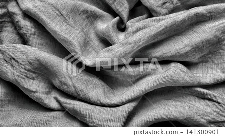 textured silver grey raw silk fabric drapery casting elegant shadows in a dramatic overhead high contrast macro shot textured silver grey raw silk fabric drapery casting elegant shadows in a dramatic overhead high contrast macro shot 141300901