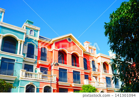 European style building architecture. Colorful building under a clear blue sky background. European style building architecture. Colorful building under a clear blue sky background. 141301094