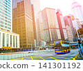 City traffic in Central Business District of Hong Kong. Red taxis and double-decker buses on road 141301192