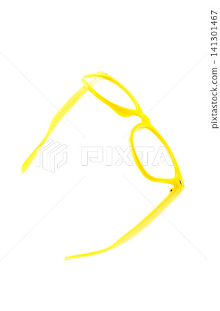 glasses plastic yellow without lenses lie half turned on an isolated white background 141301467