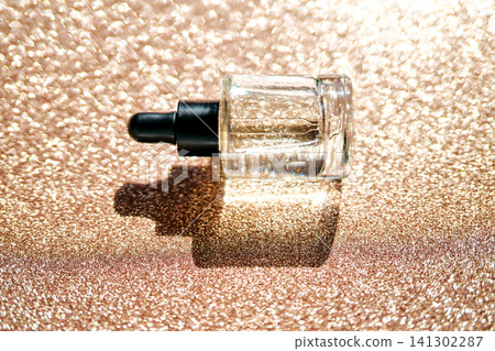 Skincare serum dropper bottle on glitter background Skincare serum dropper bottle on glitter background 141302287