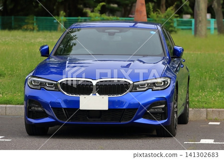 Image of a blue sports sedan made in Germany Image of a blue sports sedan made in Germany 141302683