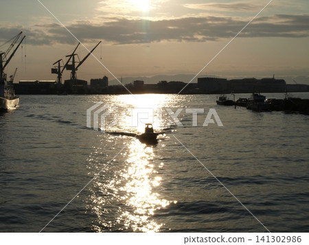 Fishing boat on its way back Fishing boat on its way back 141302986