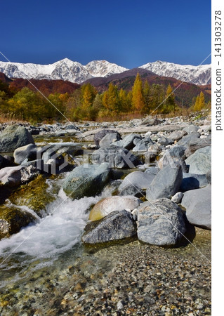 A view of the snow-capped peaks of Hakuba from Hakuba Village in autumn. A view of the snow-capped peaks of Hakuba from Hakuba Village in autumn. 141303278