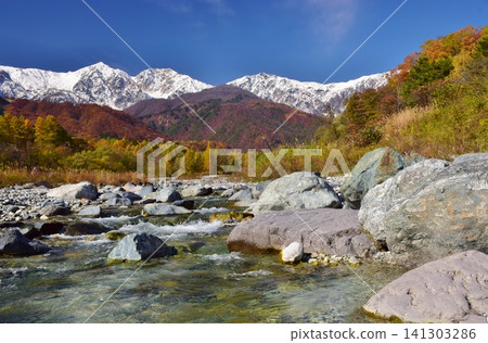 A view of the snow-capped peaks of Hakuba from Hakuba Village in autumn. A view of the snow-capped peaks of Hakuba from Hakuba Village in autumn. 141303286