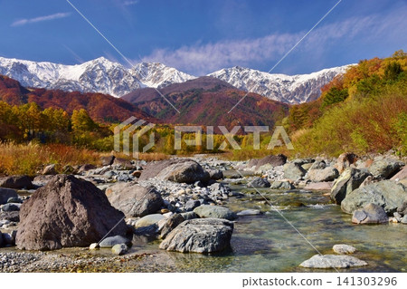 A view of the snow-capped peaks of Hakuba from Hakuba Village in autumn. A view of the snow-capped peaks of Hakuba from Hakuba Village in autumn. 141303296
