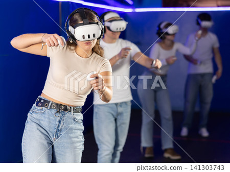 Girl playing active video games 141303743