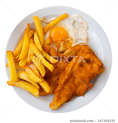 Tasty breaded pork cutlet with fried eggs and potatoes at plate Tasty breaded pork cutlet with fried eggs and potatoes at plate 141304335