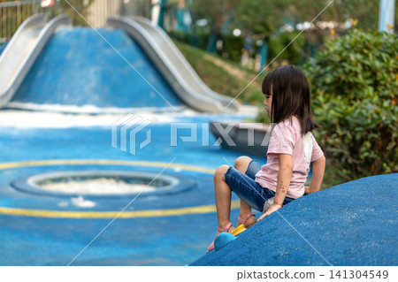 Asian Little Girl Climbing Wall at Outdoor Playground Asian Little Girl Climbing Wall at Outdoor Playground 141304549