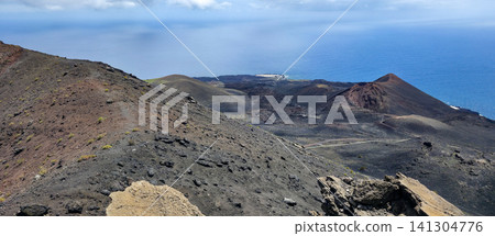 A walk along the edge of the crater of the San Antonio volcano on the Canary Island of La Palma along the tourist trail. High quality photo A walk along the edge of the crater of the San Antonio volcano on the Canary Island of La Palma along the tourist trail. High quality photo 141304776