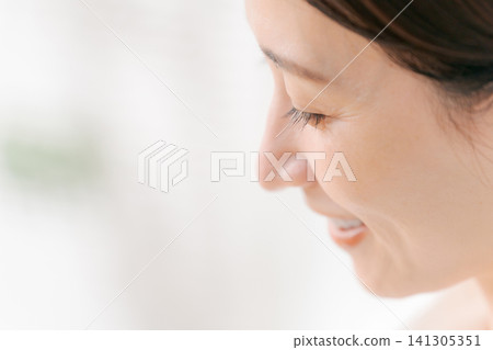 A woman's ear with earrings A woman's ear with earrings 141305351