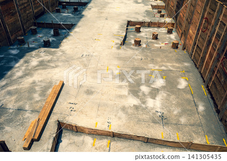 Foundation work in the basement of a building: Emphasis on warm and cool colors. Foundation work in the basement of a building: Emphasis on warm and cool colors. 141305435