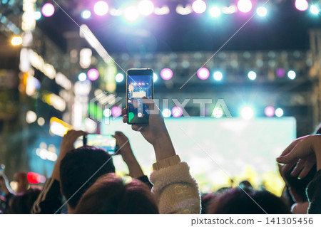 Audience filming the concert hall 141305456