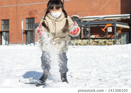Happy Asian Child Playing in Snow Winter Outdoor, Cute Girl Making Snowball and Snowman, Joyful Cold Weather Lifestyle Happy Asian Child Playing in Snow Winter Outdoor, Cute Girl Making Snowball and Snowman, Joyful Cold Weather Lifestyle 141306105