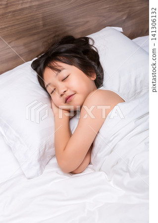 Asian little girl sleeping peacefully in bed, healthy sleep and childhood rest concept 141306132